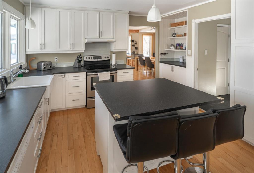 Kitchen open to dining room with bar area
