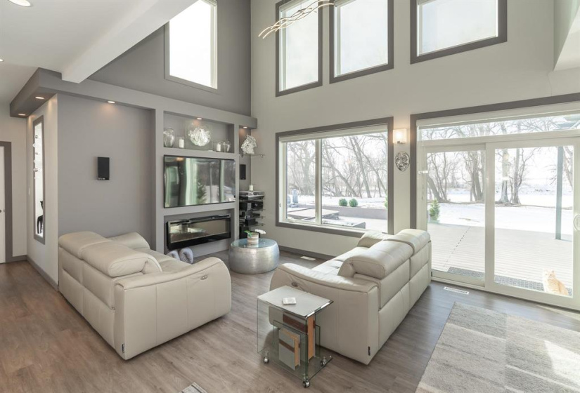 Great room with 20’ ceilings and huge windows