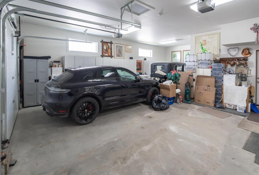 Triple attached garage with hot & cold water and floor drain with sump pump so you can wash your vehicles!