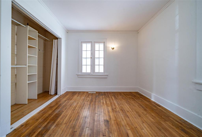 Large primary with ample closet space.