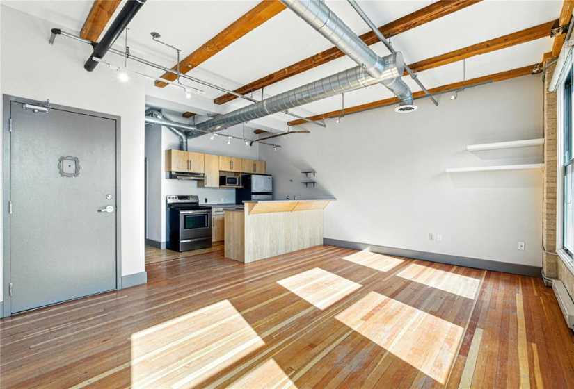 Open concept full of light and breakfast bar