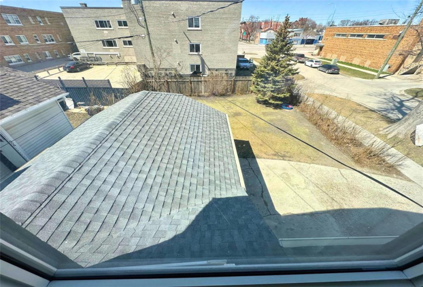 second floor kitchen view of garage and back yard