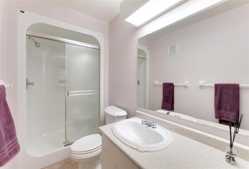 En-suite bath in primary bedroom