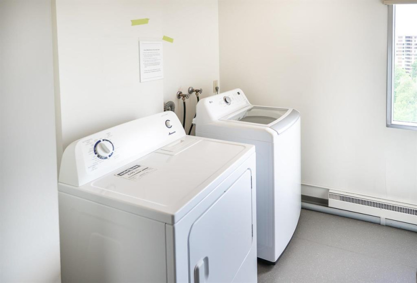 Shared laundry at the end of the hall is included in the condo fees.