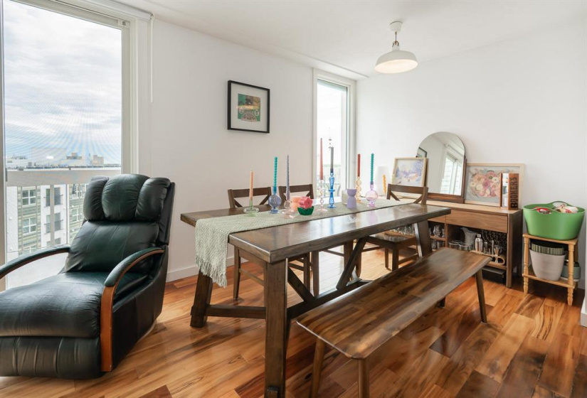 Roomy dining area with large window in the corner