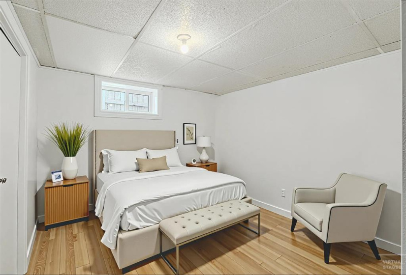 virtually staged: basement Bedroom (window may not meet egress standards of current building code)
