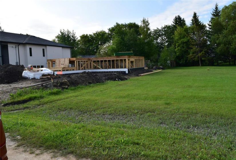 New home being built next to the lot with a couple more beside that one