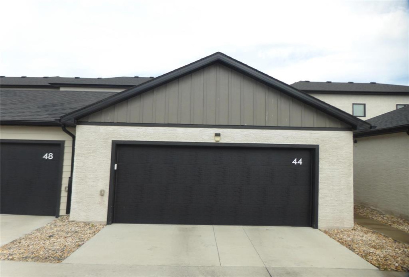 22ft x 22ft double detached garage with insulated overhead door & opener. 3rd car parking with plug behind the garage.