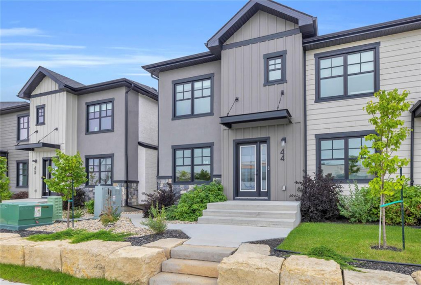 Tasteful use of stucco, cultured stone & composite materials on the front elevation.
