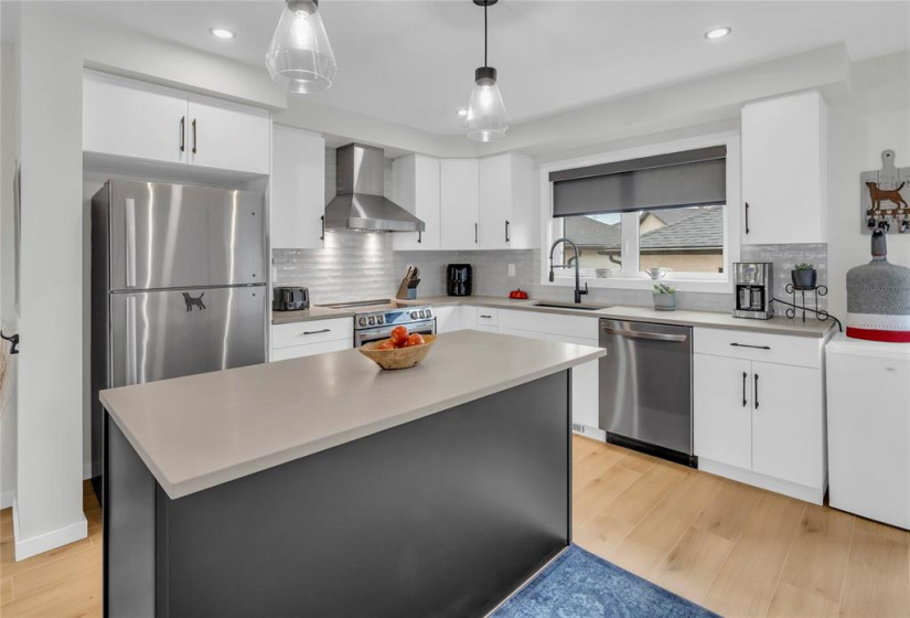 5.4' x 3.58' Quartz/Caesarstone Island. Tile backsplash, S.S. built in Dshwr..