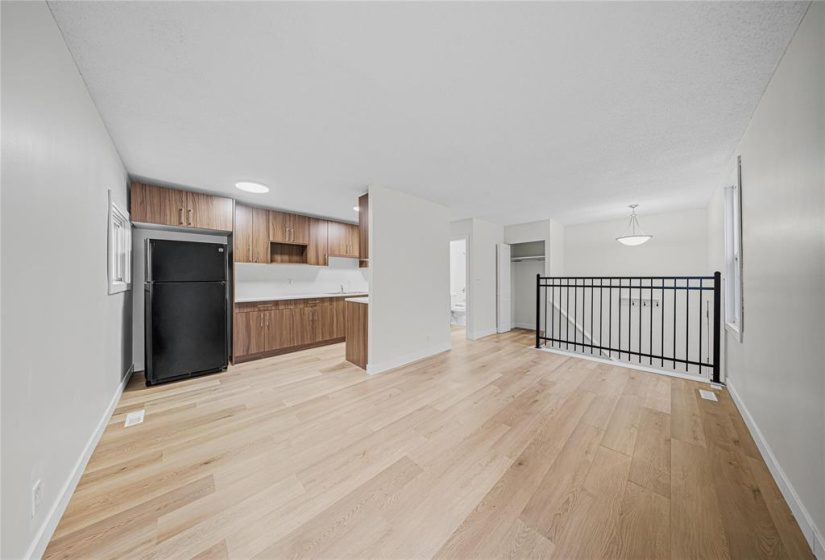 Living room to dining area to kitchen.