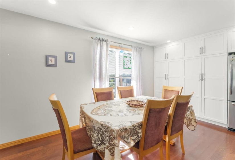 Dining area of the kitchen with plenty of built-in cupboards