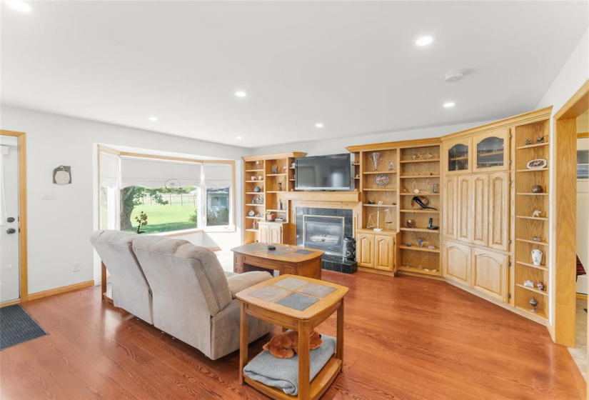 Great room off the kitchen with door to back deck.  Built-in wall unit