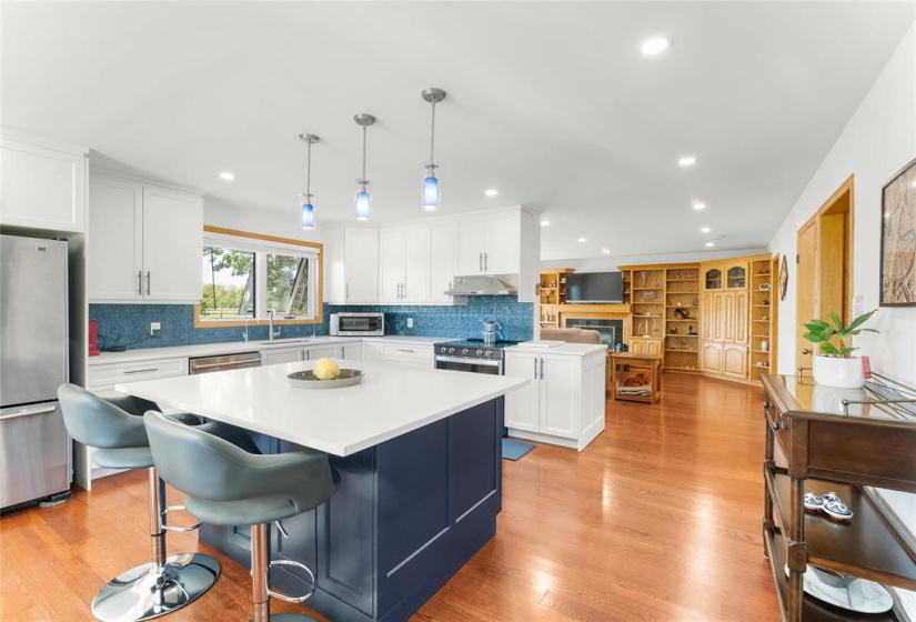 Beautiful revamped kitchen in 2023 with quartz countertops.  So much counter and cupboard space.