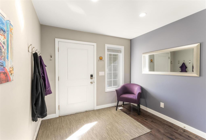 Spacious front entrance. There is a coat closet, door to garage and door to powder room