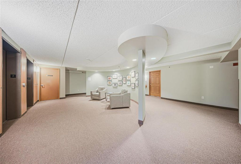 Welcoming second floor foyer as you get off the elevators. There is also a little library area to get books