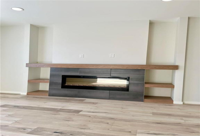 Picture of the NEW linear style Fire Place. Entertainment unit shown is Optional.