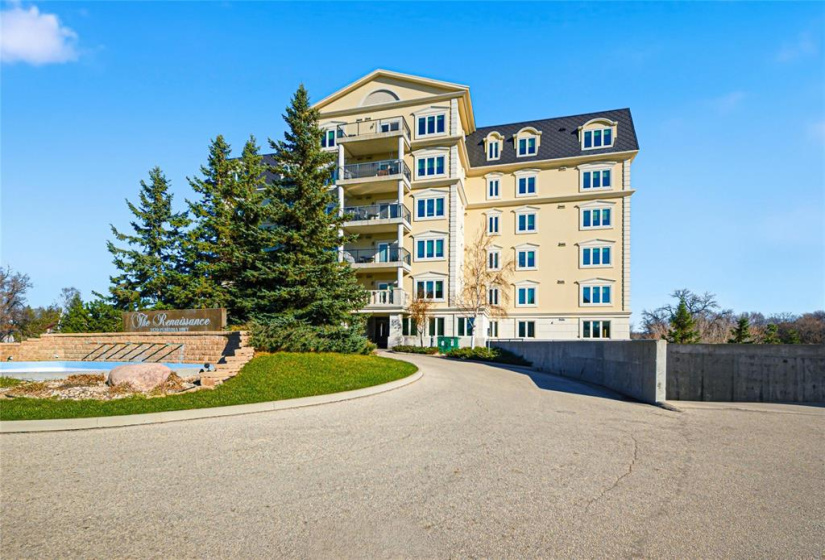 Entrance to underground parking to the right of the building.  Also where visitor parking is
