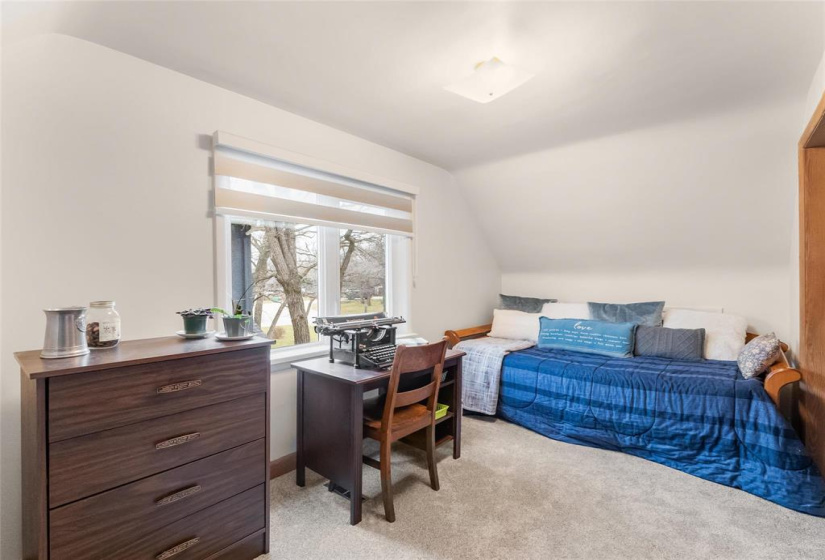 Second bedroom upstairs. New window, blinds, carpet and paint.