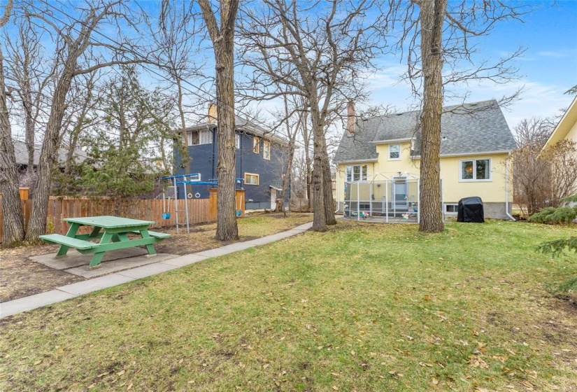 Deep 50' x 157' lot.  Picnic table, swing set and gazebo stay.