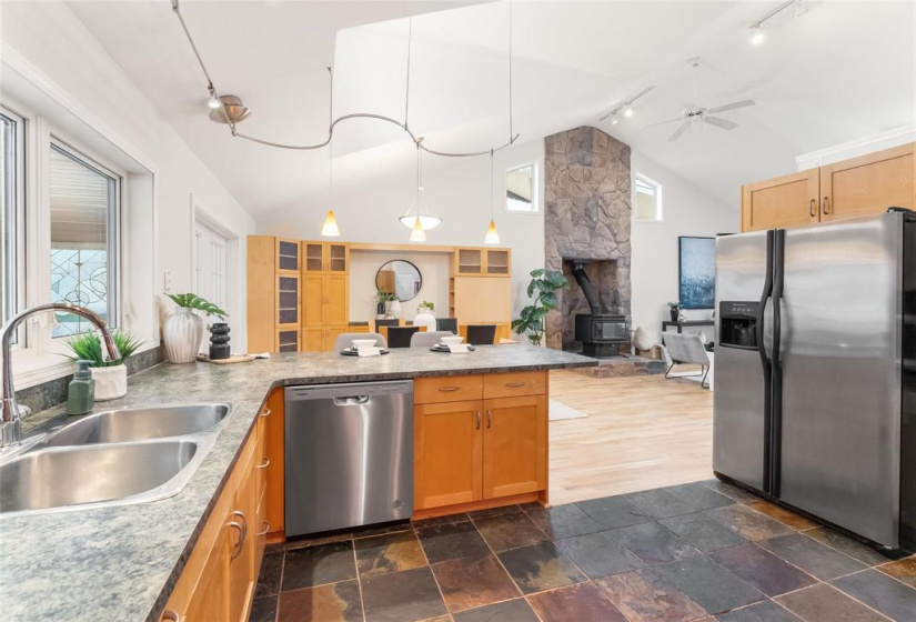 View to dining and living room areas.  Lots of counter and cupboard space. Carbon water filter