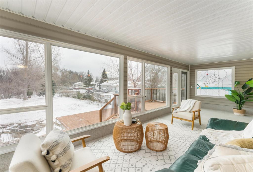 Three season peaceful, relaxing sunroom. Stained glass window.
