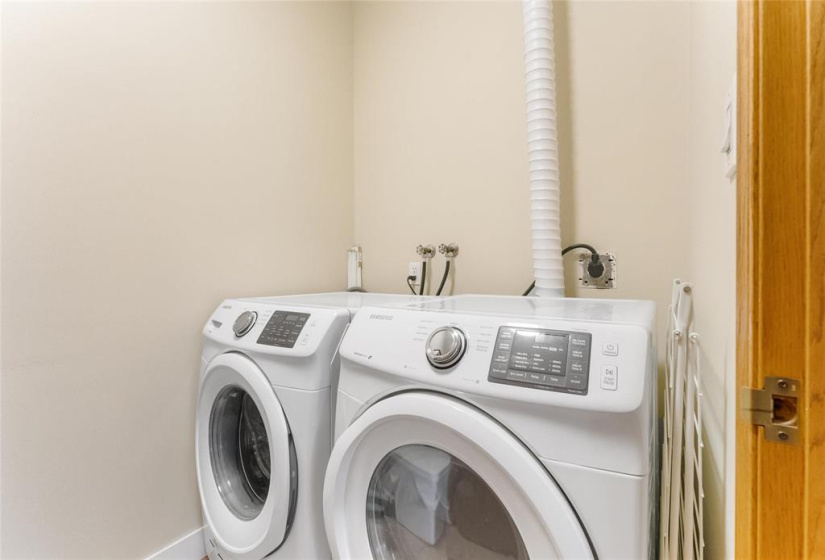 Washer and dryer included. This room also has storage, hot water tank and central vacuum canister