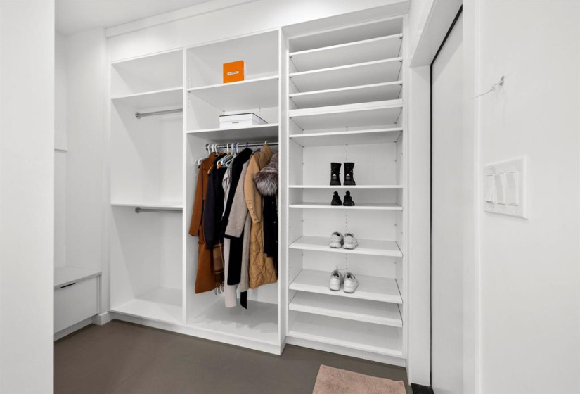 Mudroom with tons of built ins and built in bench