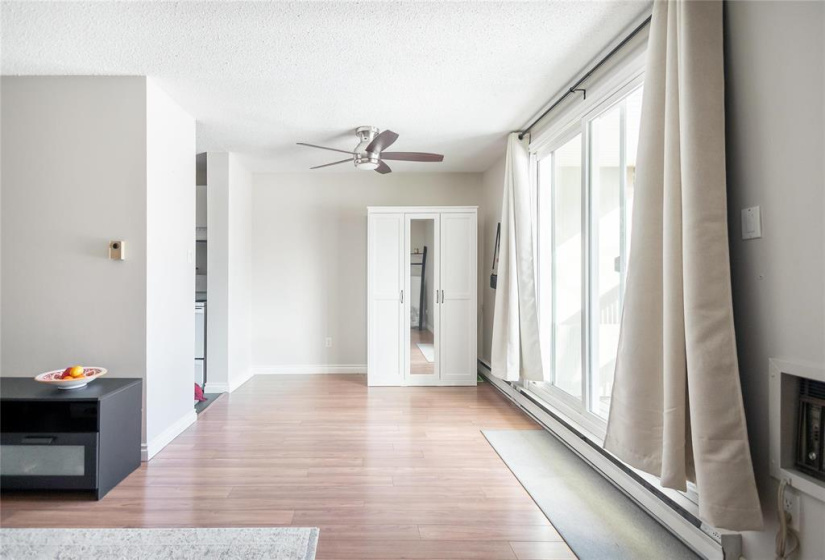 Dining room adjacent to kitchen, living room overlooking patio and greenspace.