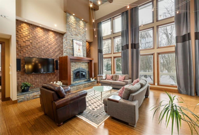 Gorgeous great room with floor to ceiling windows