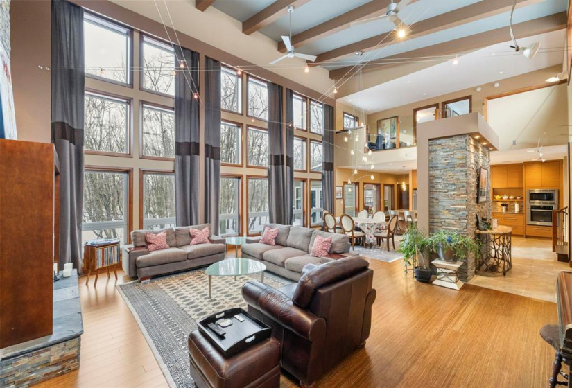 Great room is open to the dining room and features 23' ceilings