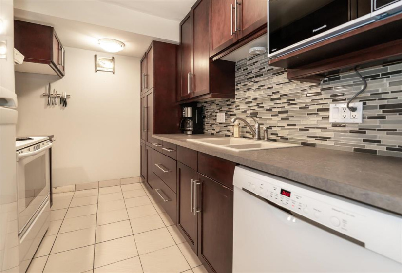 Bosch dishwasher and microwave shelf above