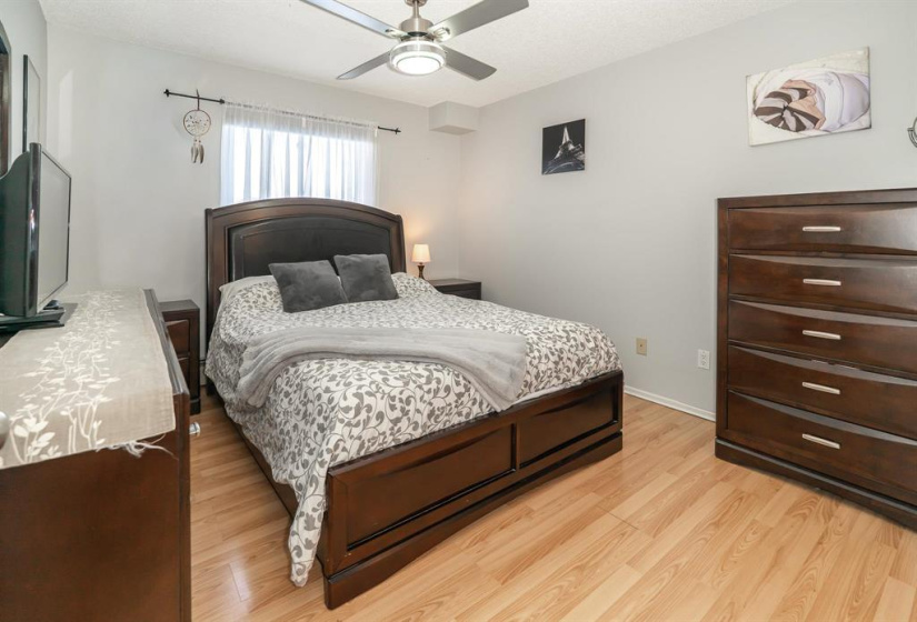 Primary bedroom with ceiling fan