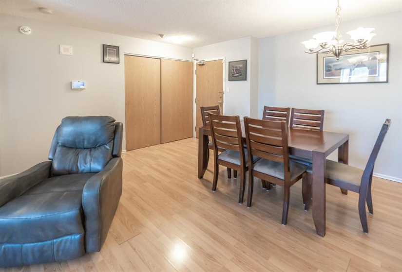 Dining room area with large front closet