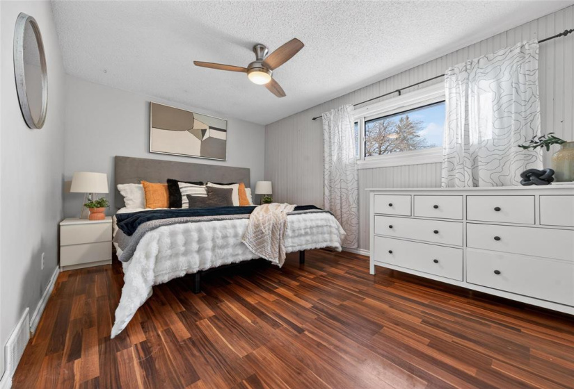 Primary with ceiling fan.