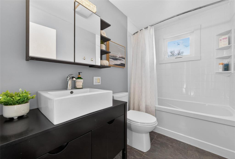 4 piece main floor bath with updated surround.