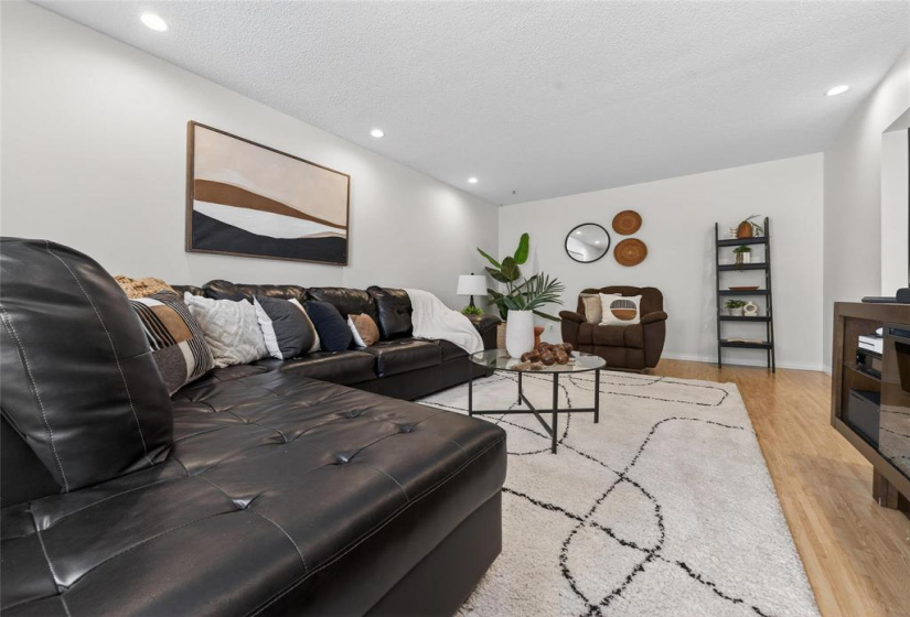 Bright & spacious living room with laminate flooring.