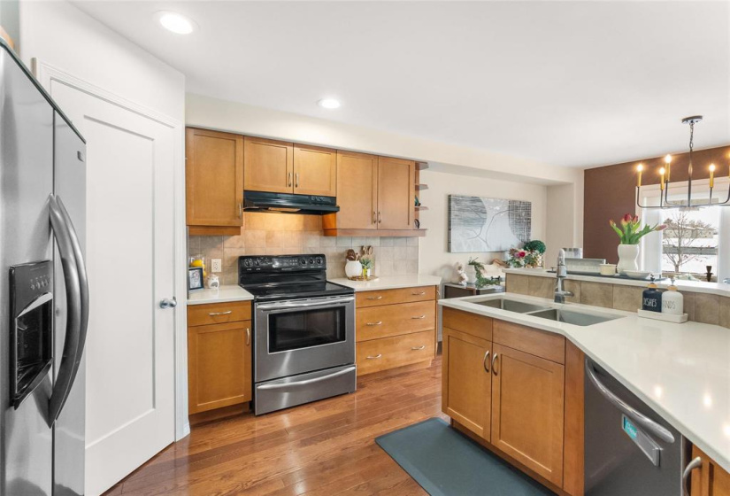 Double sinks. Hood fan vents outside.