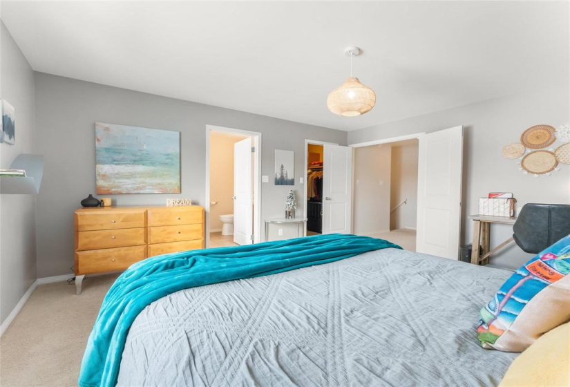 French doors. View to ensuite and walk-in closet