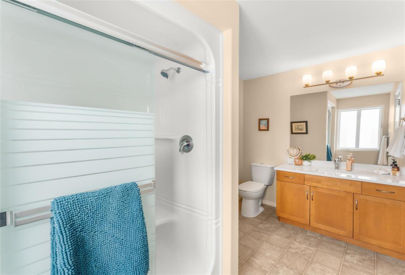 Primary bedroom bathroom with shower and quartz counters Sept 2025