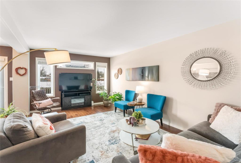 Spacious living room with plenty of room for seating.  Could have a gas fireplace in the TV insert if you wish.