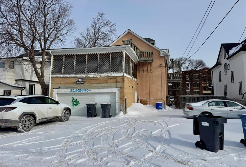 Rear parking w/ garage and sunroom above