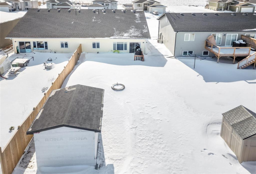 Good size back yard with large shed and fire pit