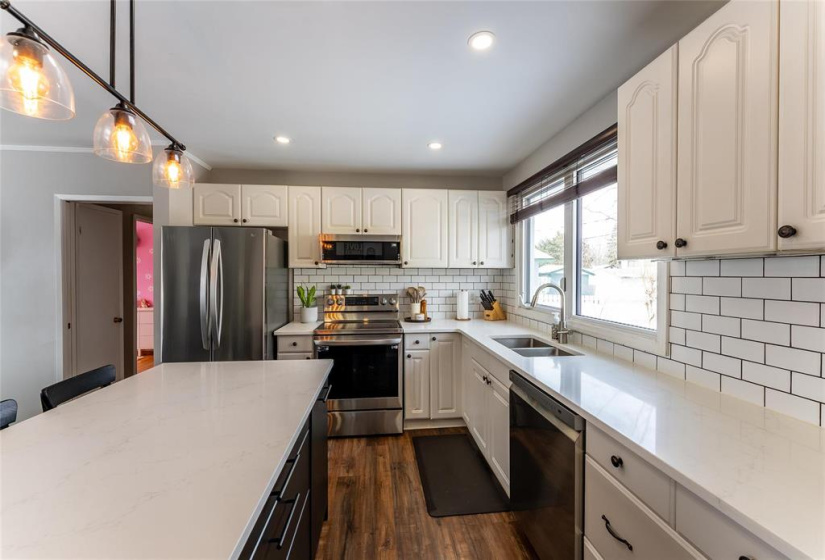 Quartz Island kitchen with tile back splash