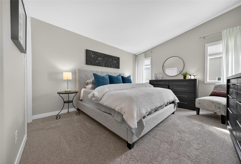 Primary with custom walk-in closet and ensuite.