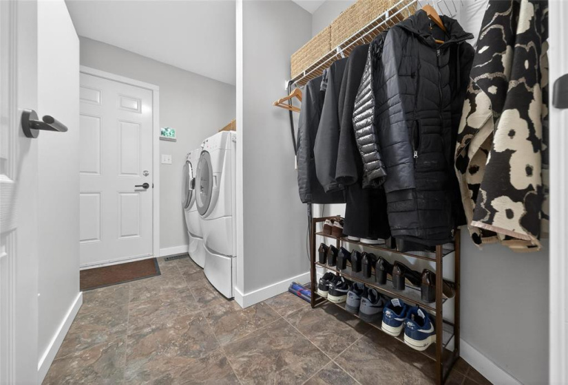 Muroom with laundry.
