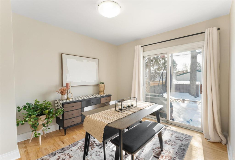Second upstairs bedroom. Currently used as a dining room. Patio doors to fenced back yard and deck.