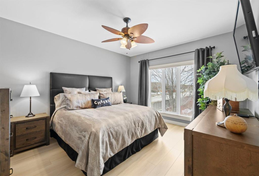 Primary bedroom overlooking the backyard oasis