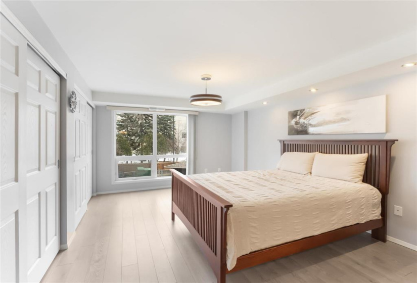 Primary bedroom with double closets and closet organizers