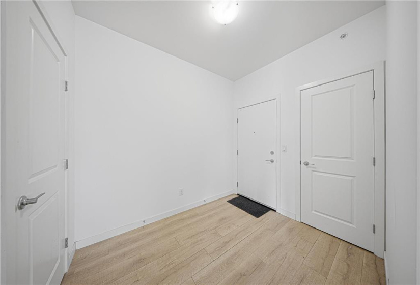 Insuite laundry beside storage , across from the coat closet